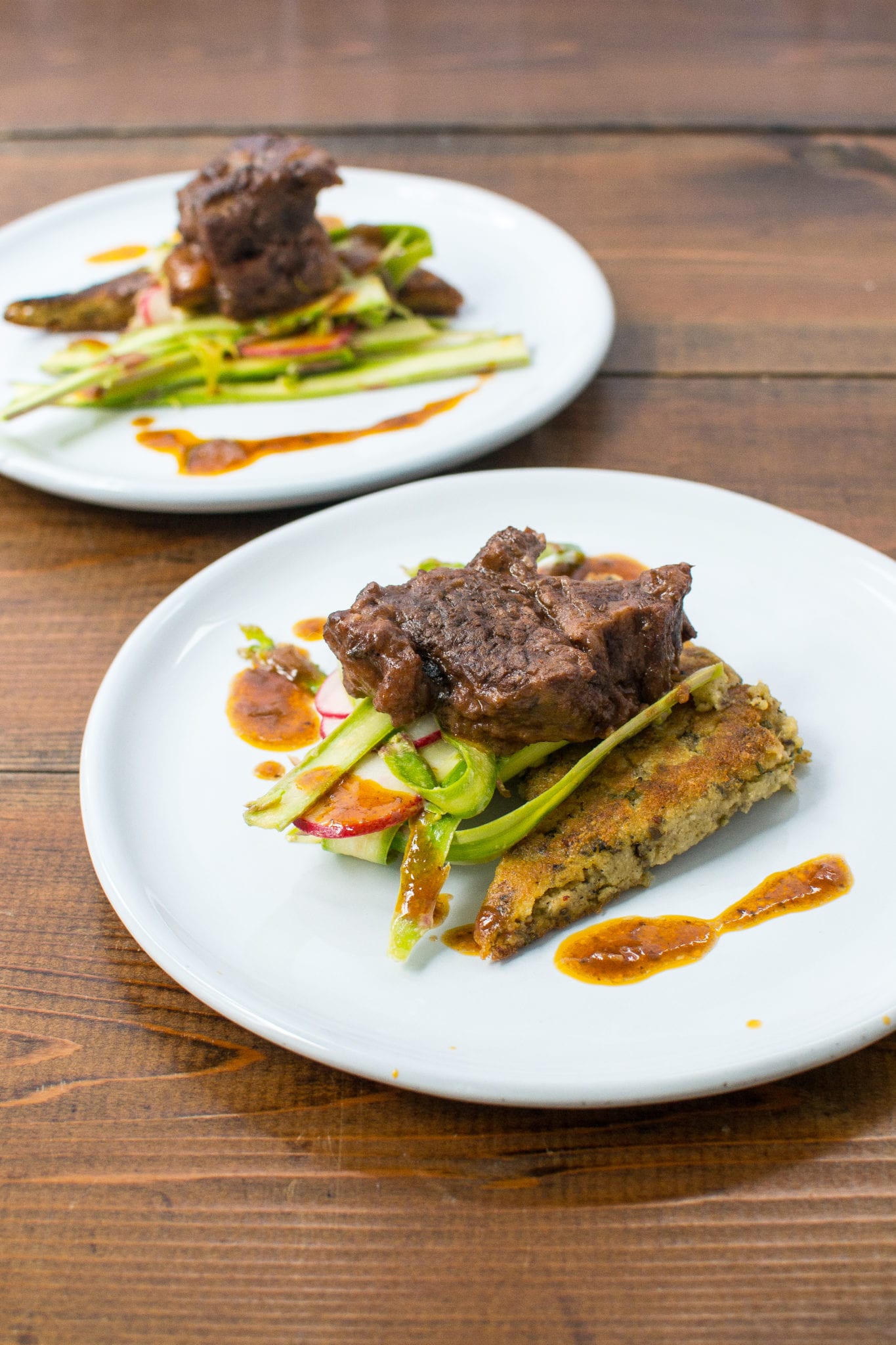 short ribs over fried polenta and shaved asparagus salad - Appetites Anonymous
